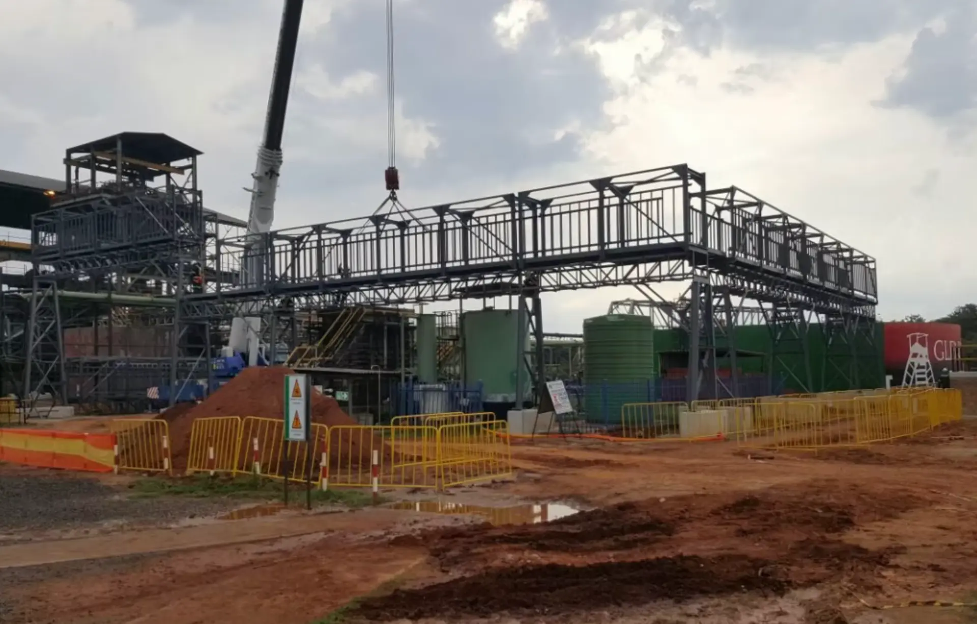 Steel walkway structure being installed at an industrial plant
